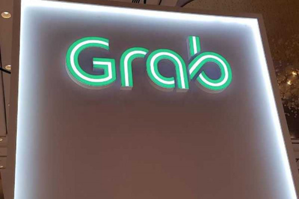 Singapore's Grab launches pilot motorbike-hailing service in Malaysia